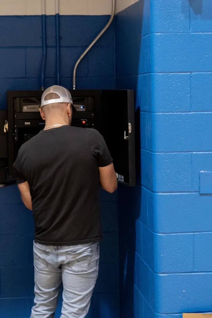 Technician installing AV equipment